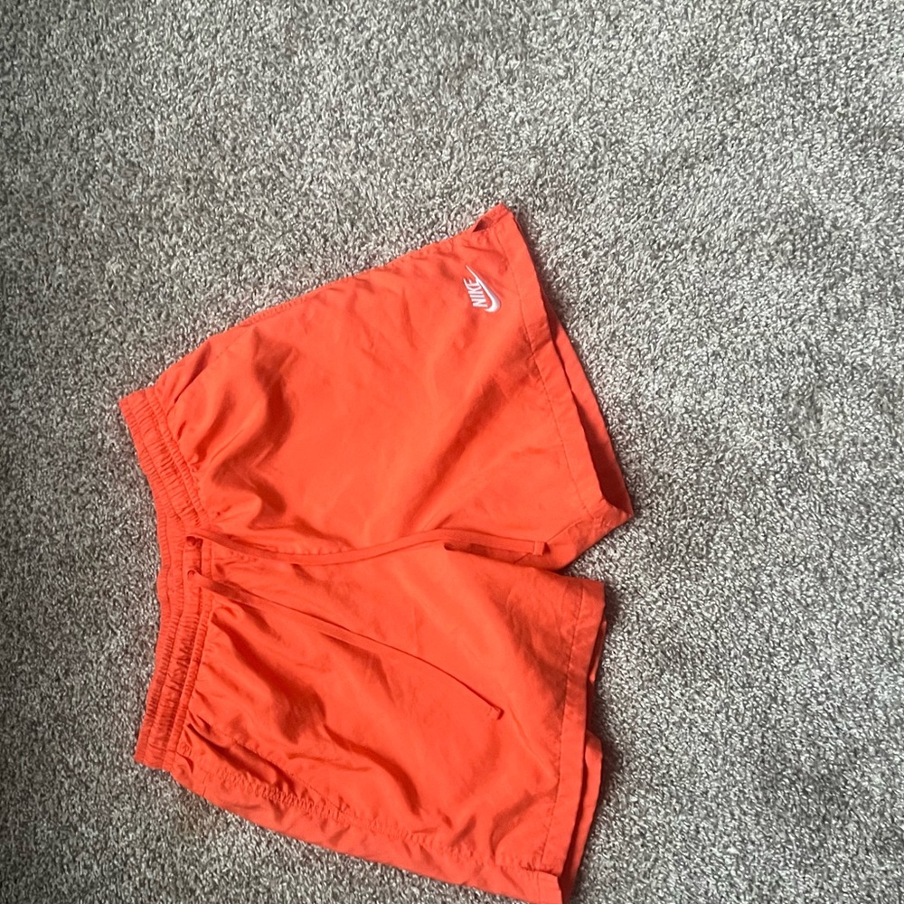 Orange Nike woven shorts
